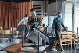 male waiters in protective workwear arranging furn 2023 11 27 05 05 28 utc scaled e1739622405572